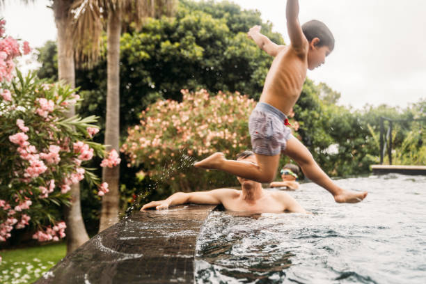 istock Family playing at the pool 1740435734