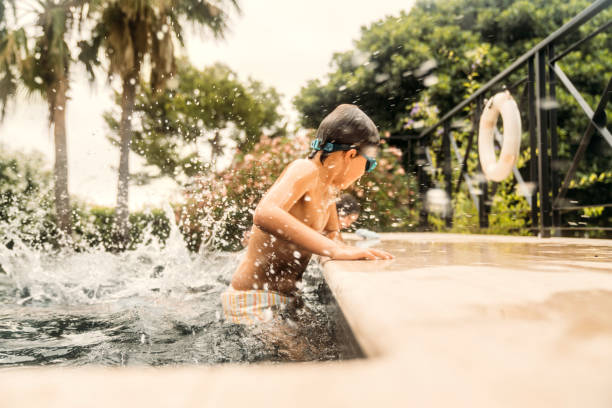 istock Family playing at the pool 1740435740