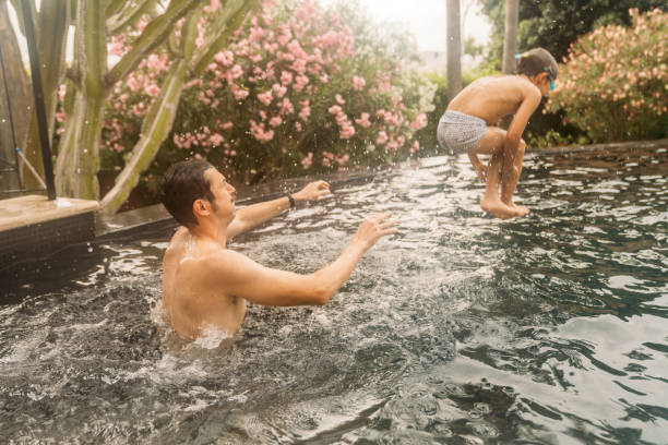 istock Family playing at the pool 1740435744