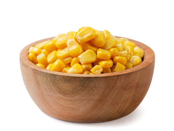 istock Canned corn in a wooden plate on a white. Isolated 1740436854
