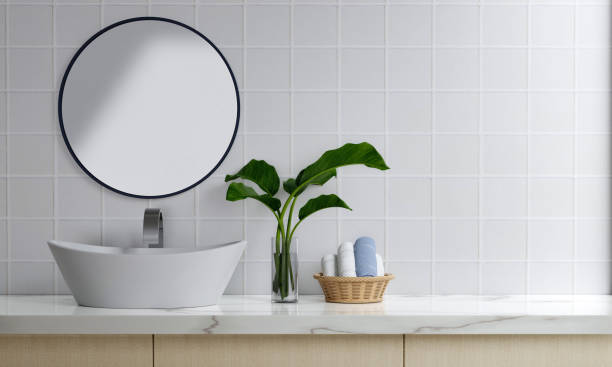 istock 3D render an empty counter with ceramic washbasin and modern style faucet in a bathroom. Blank space for products display mockup. Background, Wall tiles. 1740443838