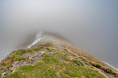 Path over a mountain ridge in the Nockberge nature reserve landscape in Carinthia