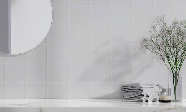 istock 3d empty marble table counter with flower, candle and towel. mockup space for over minimalist and clean bathroom background, 3d rendering 1740444726