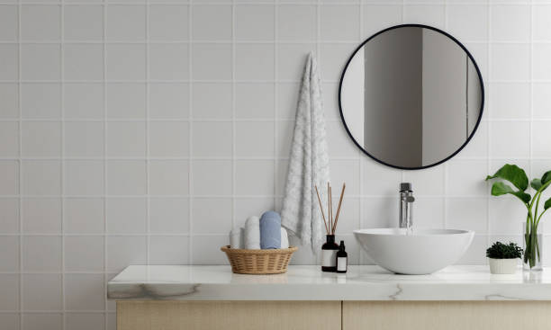 istock 3D render an empty counter with ceramic washbasin and modern style faucet in a bathroom. Blank space for products display mockup. Background, Wall tiles. 1740444741