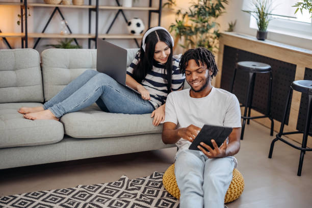 istock Couple surfing the net at home 1740448364