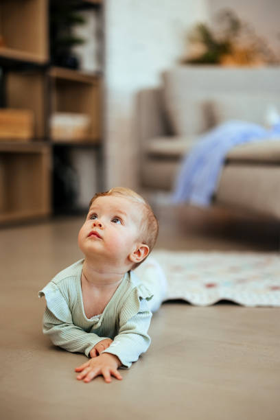 istock Baby girl learning to crawl 1740451008