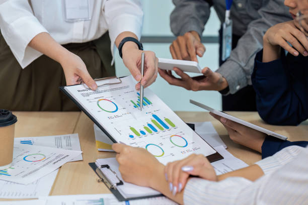 istock Business people teamwork with analysis cost graph on desk at meeting room 1740453315