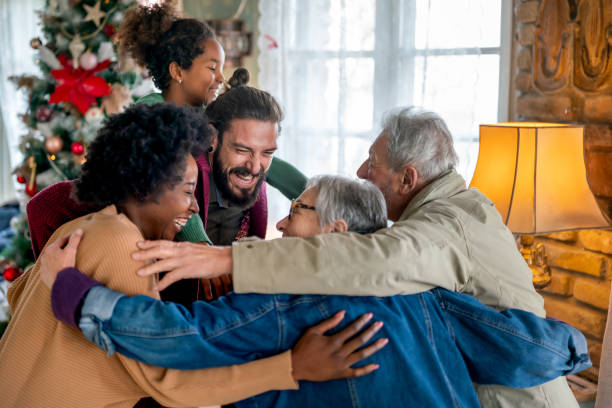 istock Cheerful extended multiethnic family having fun while celebrating Christmas together at home. 1740454976