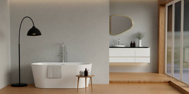 istock Minimal style white bathroom 3d render, grey wall and wood floor, The room has large windows. 3d render 1740455149