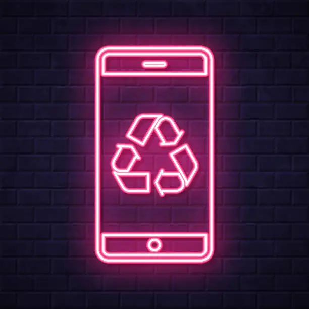 Vector illustration of Smartphone with recycle symbol. Glowing neon icon on brick wall background
