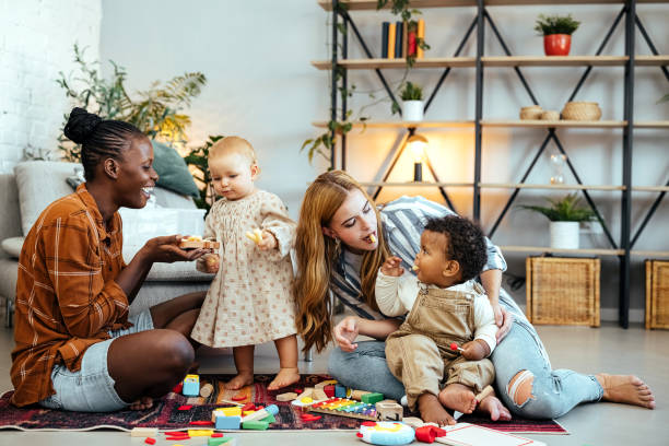 istock Best friends and their babies at home 1740469872