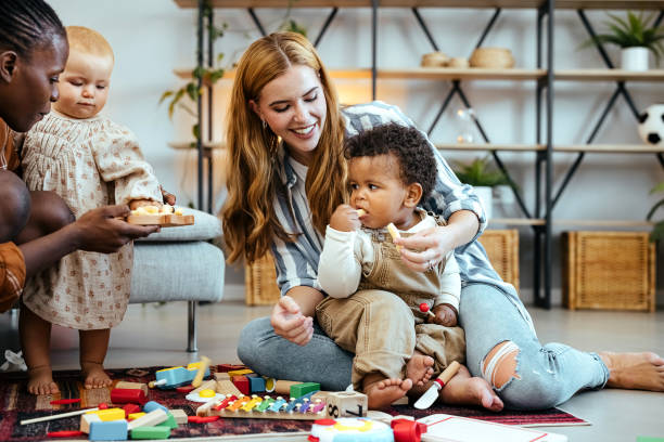 istock Best friends and their babies at home 1740469915