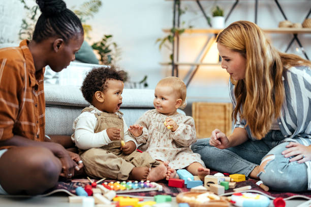 istock Best friends and their babies at home 1740475580