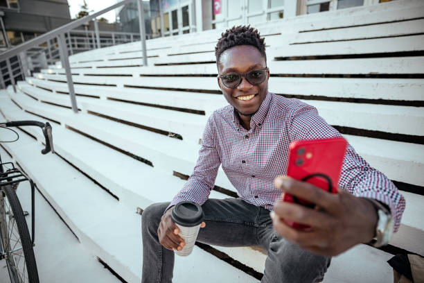 istock Man uses a mobile phone outdoors 1740477255