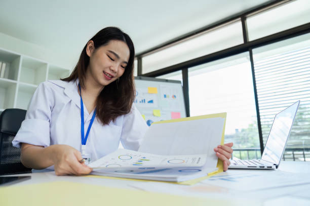 istock Close up bookkeepers working with balance sheet to analyze problems and find solutions to bringing develop business 1740479113
