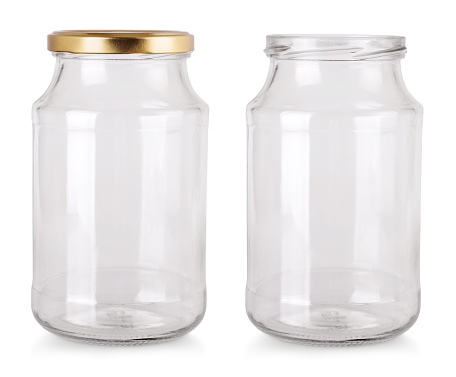 The empty glass jar isolated on white background