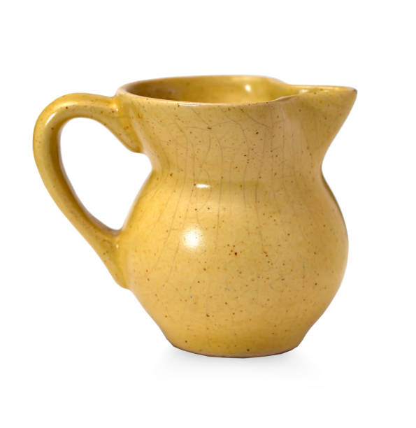 istock earthenware yellow jug isolated on white background 1740487179