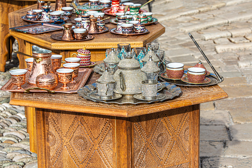 The metal coffee and tea set in the oriental market