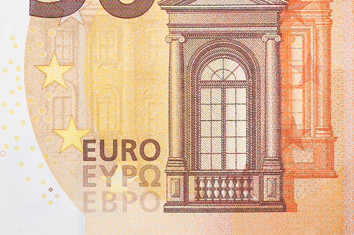 Benjamin Franklin peeking through  50 euro banknotes for design purpose