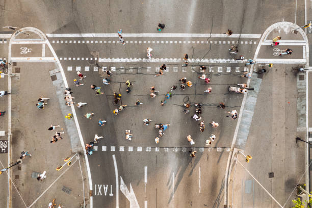 istock Crowd of people walking at zebra crossing 1740494160