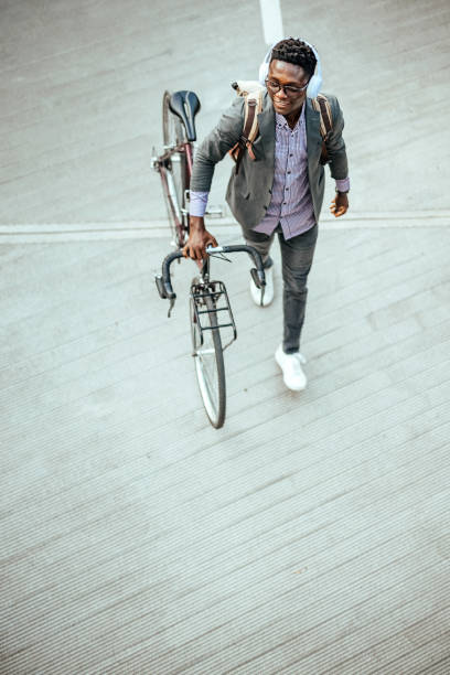 istock Young businessman with bike 1740498593