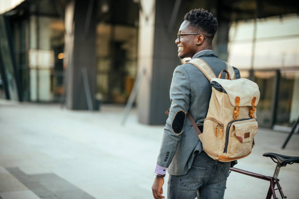 istock Handsome young man with bicycle in a city 1740503669