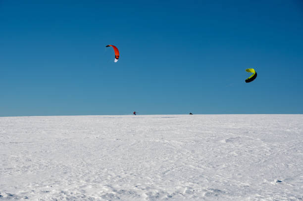 istock Kitesurfing in the snow with a blue sky 1740513654