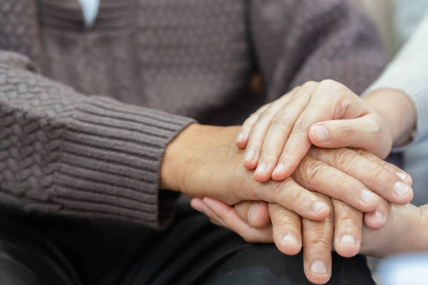 istock Doctors or nurses hold hands of elderly patients to support and soothe 1740516146