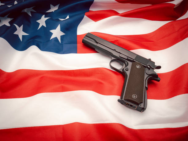 istock A handgun on the American flag background 1740530892