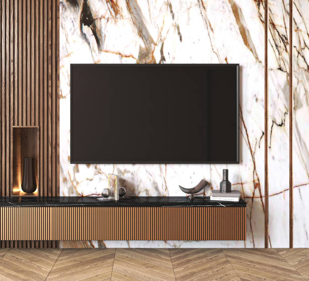 istock Classic expensive luxury light TV wall mock up with commode and wood panels. Modern interior living room with marble beige background. 3d rendering. High quality 3d illustration 1740545073