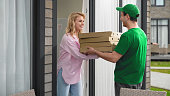 Fast food delivery service. Italian pizza boxes home deliver. Pizzeria courier.