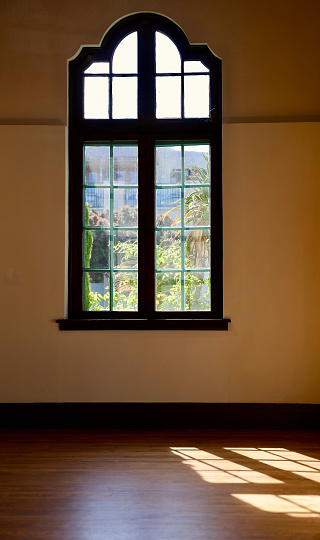 Interior view of vintage pane window with scalloped edge
