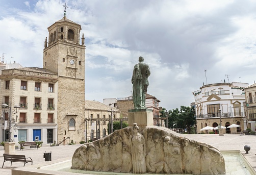 Ubeda, Spain - Jun 2, 2019: General Leopoldo Saro Marin Monument and Clock Tower (Torre del Reloj)  at Plaza Andalucia Square - Ubeda, Jaen, Spain