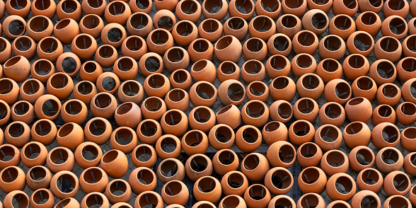 The background set of brown clay pots close-up