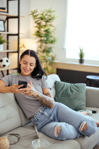istock Woman types a message on the phone 1740624187
