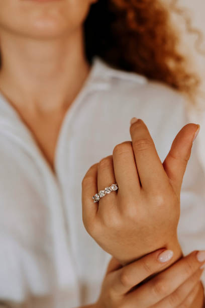 istock Woman wearing a diamond ring on her finger. 1740629313