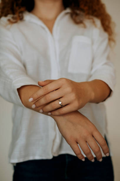 istock Woman wearing a diamond ring on her finger. 1740629321