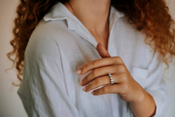 istock Woman wearing a diamond ring on her finger. 1740629382