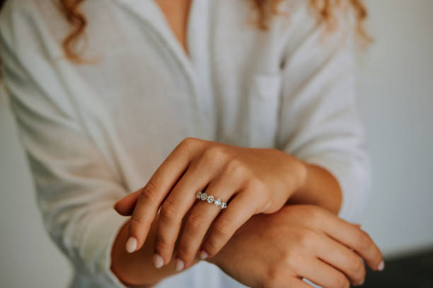 istock Woman wearing a diamond ring on her finger. 1740629848
