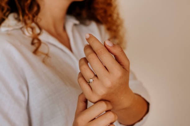 istock Woman wearing a diamond ring on her finger. 1740629851