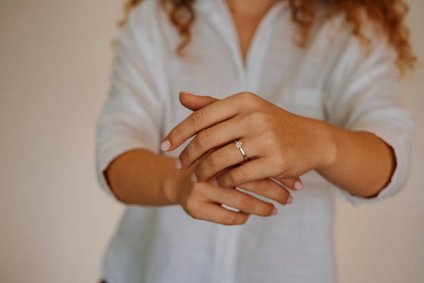 istock Woman wearing a diamond ring on her finger. 1740629853