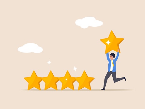 User experience. Investment rating concept. Customer feedback stars rating or business, businessman holding golden yellow star to added to 5 stars rating