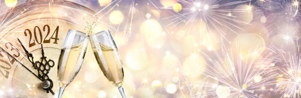 2024 Happy New Year - Celebration With Champagne And Clock - Gold Abstract Defocused Bokeh Lights stock photo