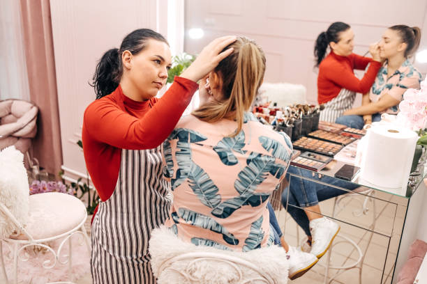 istock Young woman doing makeup in beauty salon 1740641708
