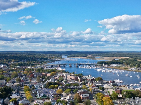 Aerial view of picturesque downtown Newburyport, Massachusetts featuring marina, boats, and traditional homes