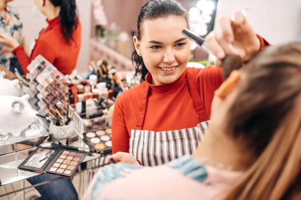 istock Young woman doing makeup in beauty salon 1740644359