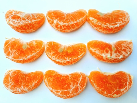 Three mandarins peeled.