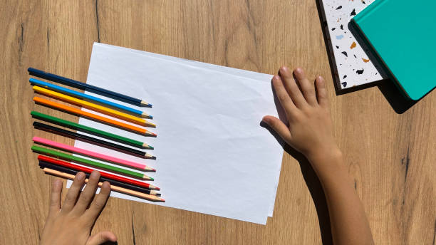 istock Children's drawing with colorful pencils on clean paper 1740670416