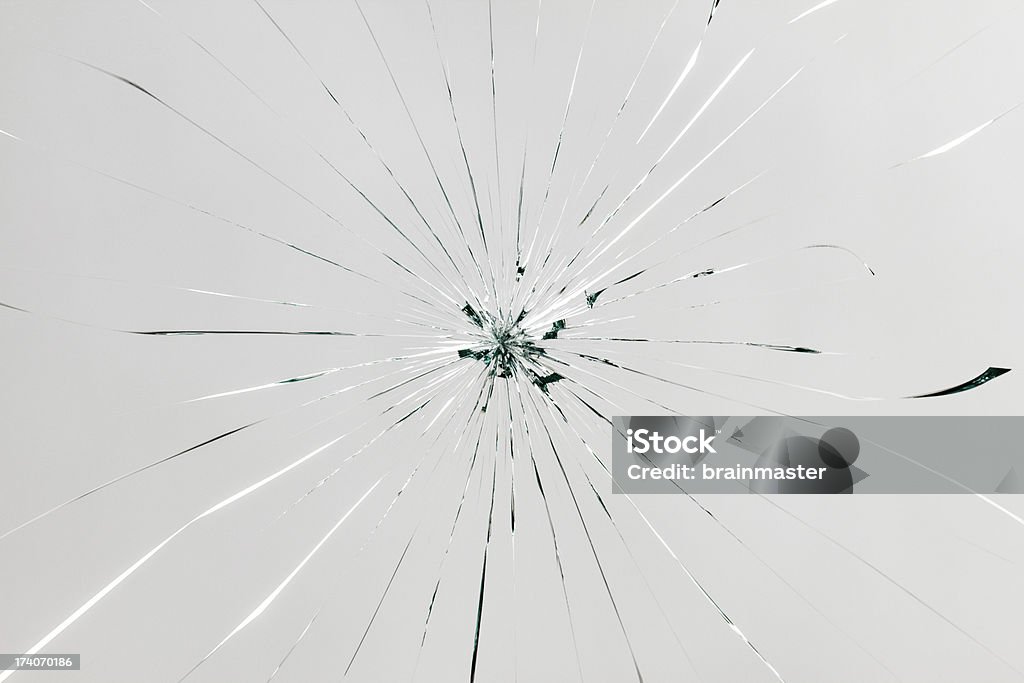 Broken glass "High detailed studio photographed shattered glass, cracked on grey background." Shattered Glass Stock Photo