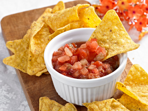 Close up of Corn Chips with Salsa Sauce.